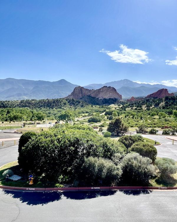 Plants, parking lot and mountains at Garden of the Gods