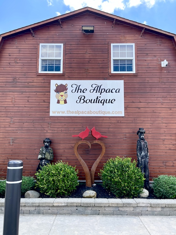 Large red barn that houses the Alpaca Boutique.