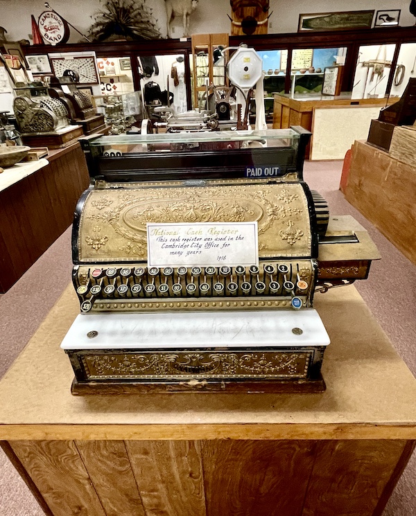 Antique metal cash register on display that was used in the Cambridge City Office in 1916