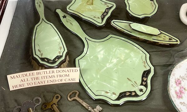 Mint green antique ladies grooming items on display at Nebraska's Cambridge Museum