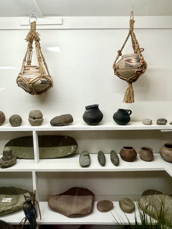 Vessels, tools and hanging gourds on display at the Nebraska's Cambridge Museum