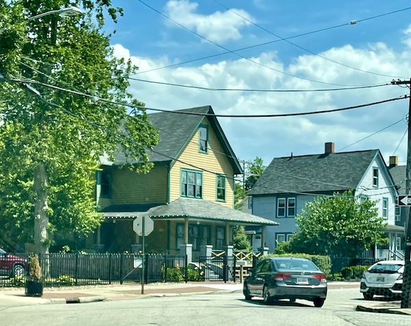 Residential neighborhood with cars as houses. The yellow one is The Christmas Story House