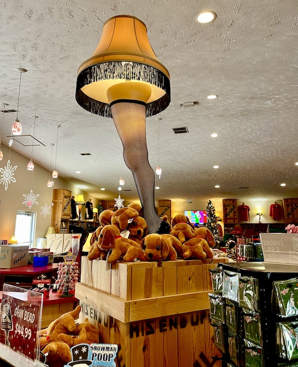 Large leg lamp with fringed shade on display at the museum of A Christmas Story house.