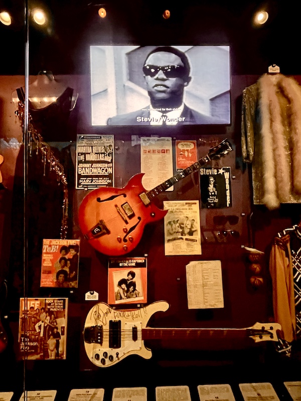 Stevie Wonder plus albums and guitars representing the Motown sound at Rock and Roll Hall of Fame