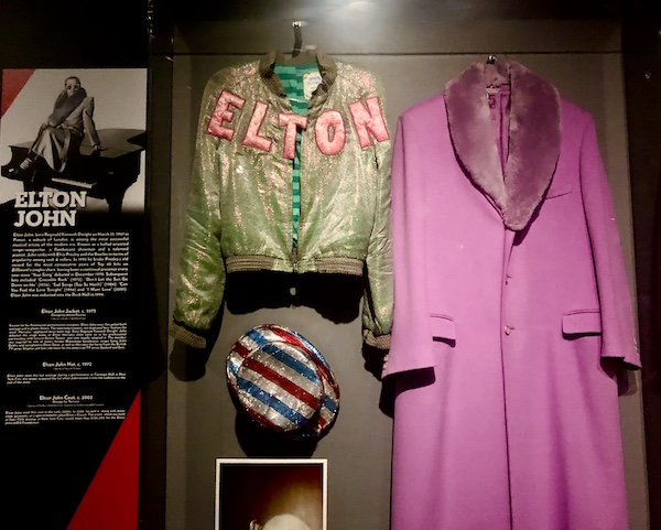 Bright pink coat and other attire worn by Elton John on display at Rock and Roll Hall of Fame