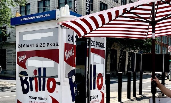 Large Brillo box, red and white striped umbrella and Andy Warhol Museum Pittsburgh in background