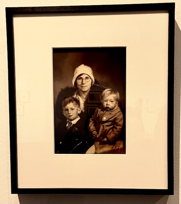 Sepia photo of Andy Warhol, his mother and brother when the boys were quite young.