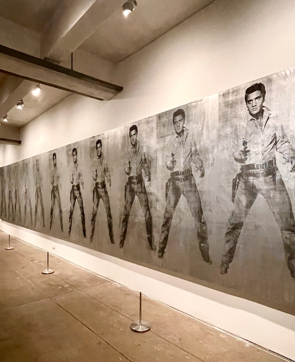 Black and white images of Elvis Presley cover an entire wall at the Andy Warhol Museum Pittsburgh