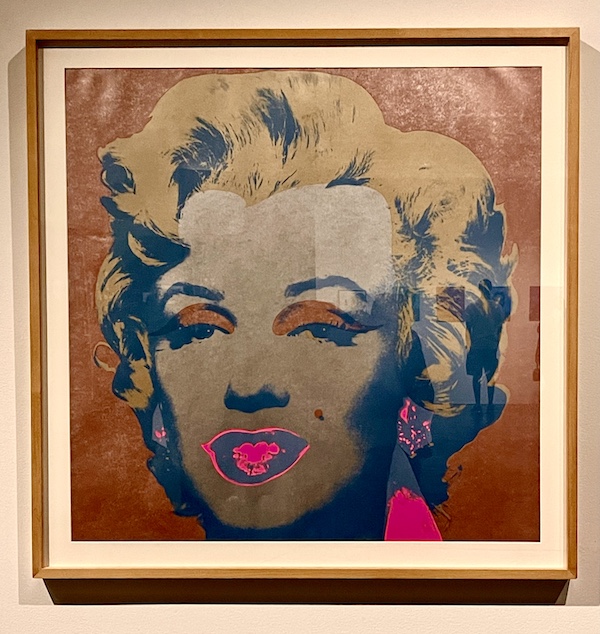 Painting of Marilyn Monroe with bright pink around mouth at the Andy Warhol Museum Pittsburgh