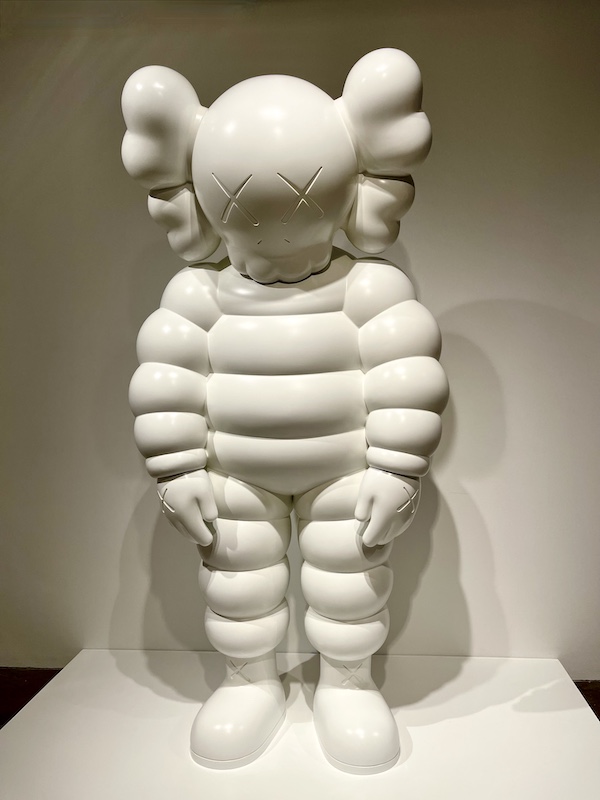 Michelin man-like statue in white done by artist Kaws on display at the Andy Warhol Museum Pittsburgh