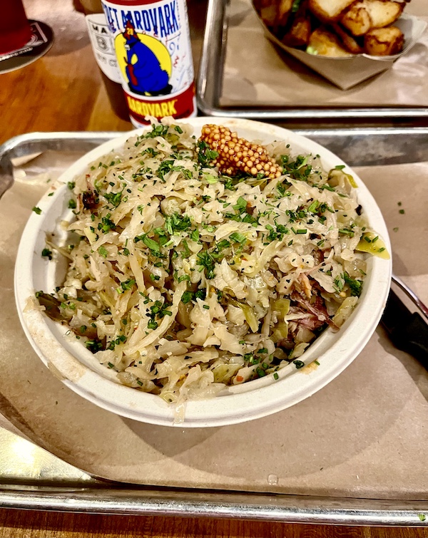Large plate of meat and cabbage on our table at Michael Symon's Mabel's BBQ
