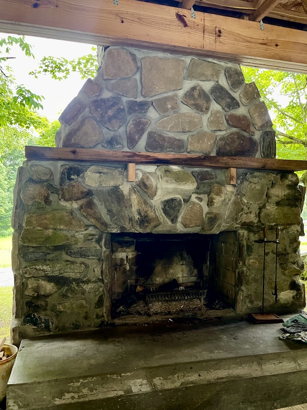 Hand build stone outdoor fireplace at the campground in Upstate New York