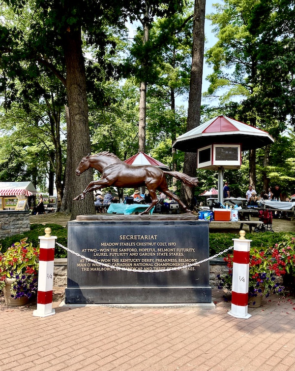 Bronze sculpture of a horse set in the woods of Historic Saratoga Race Course