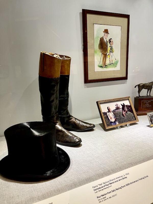 Top hat, riding boots photo and caricature on display at National Museum of Racing and Hall of Fame