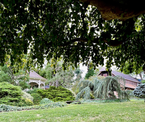 By the Sand Sculptures Peddler's Village trees hide a gazebo and big red barn