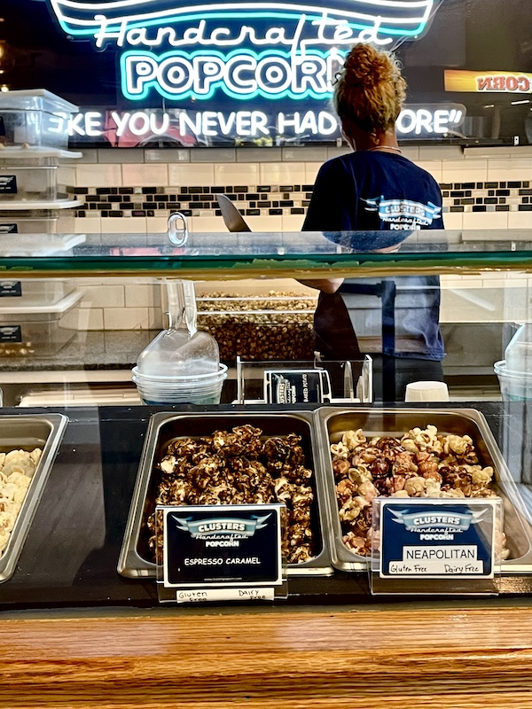 Inside a popcorn store in Peddler's Village with neon signs