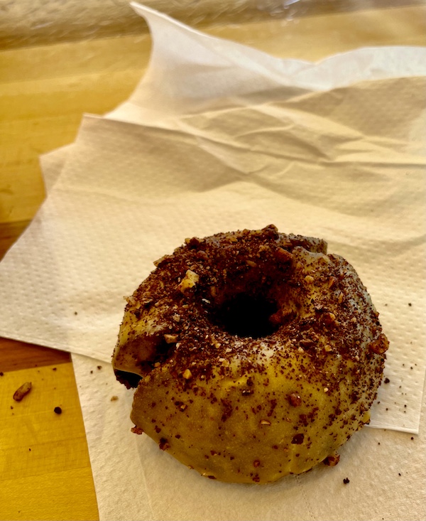 Donut sitting atop deli paper on a table at Federal Donuts on our Tour of Downtown Philadelphia