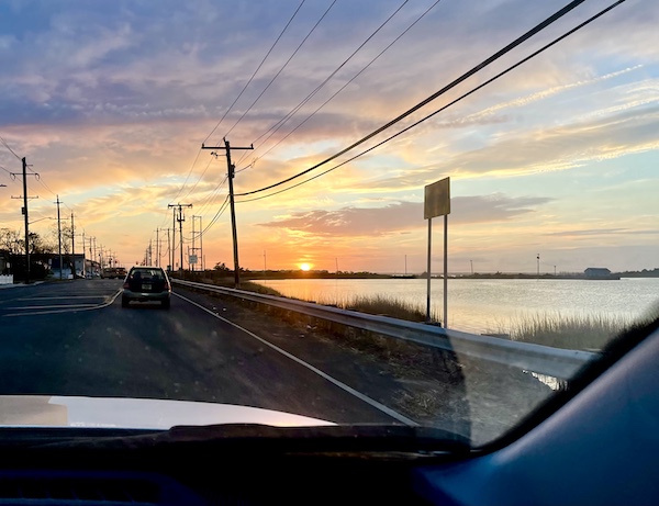 Sunset seen through the windshield of our Jeep.