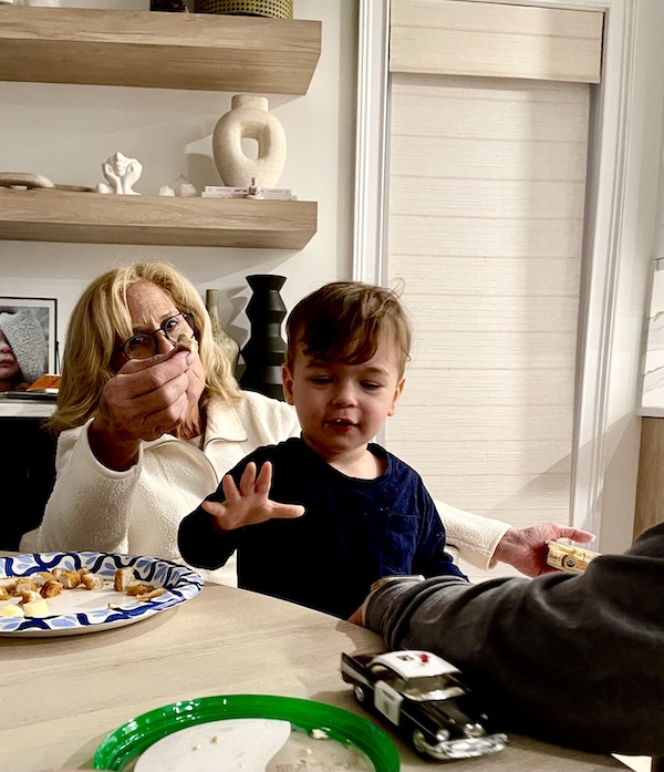 Blonde woman sitting at a table with her grandson. One of the best Autumn Memories at Jersey Shore