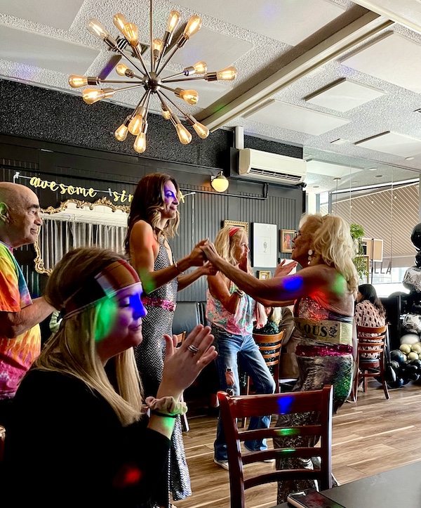 People dancing at a birthday party at a restaurant at the Jersey shore.