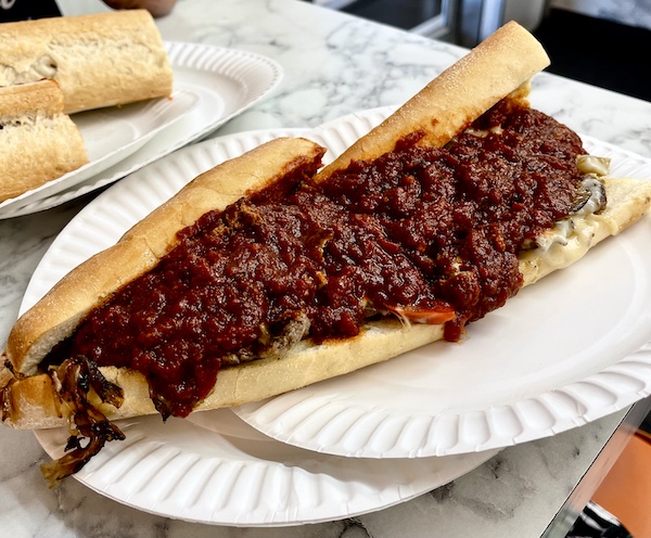 Cheesesteak sandwich on white paper plates. More Autumn Memories at Jersey Shore