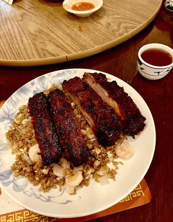 White plate topped with spare ribs and fried rice from China Sea of Absecon NJ