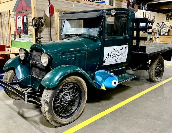 Dark green antique pickup truck at The Market at the Mill Pickens SC