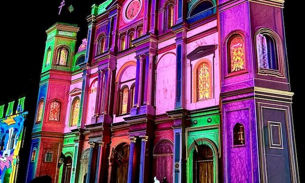Multicolor transformation of a white church for Celebrating Super Bowl NOLA Style
