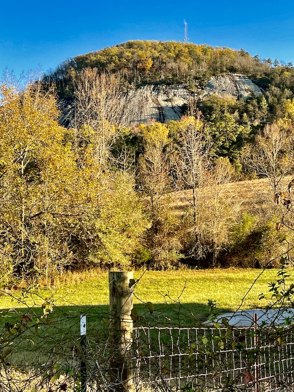 Rock formation with trees and lawn on our route.