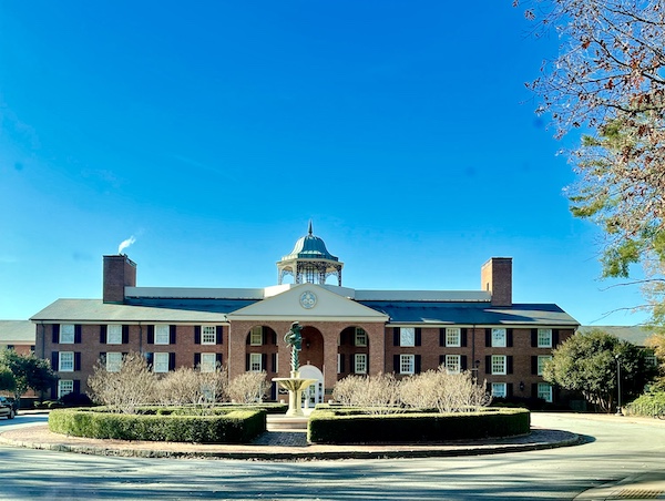 Red brick Federal style dorm building with landscaping in front seen on our South Carolina College Tour