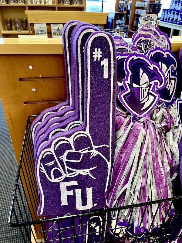 Purple foam finger and other items for sale at the campus store visited on our South Carolina College Tour