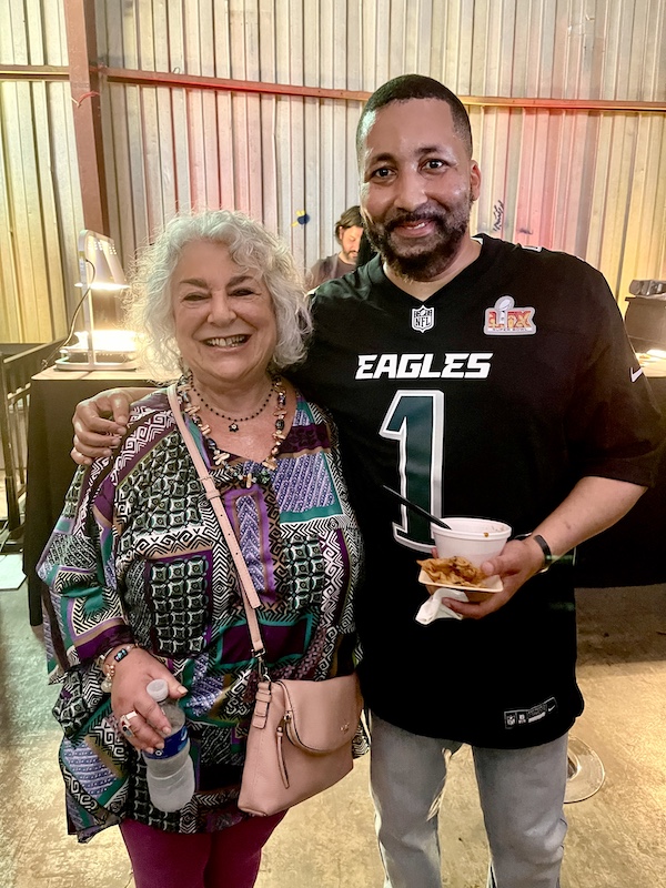 Me with bearded man in black and green football jersey at Family Style FoodFest NOLA