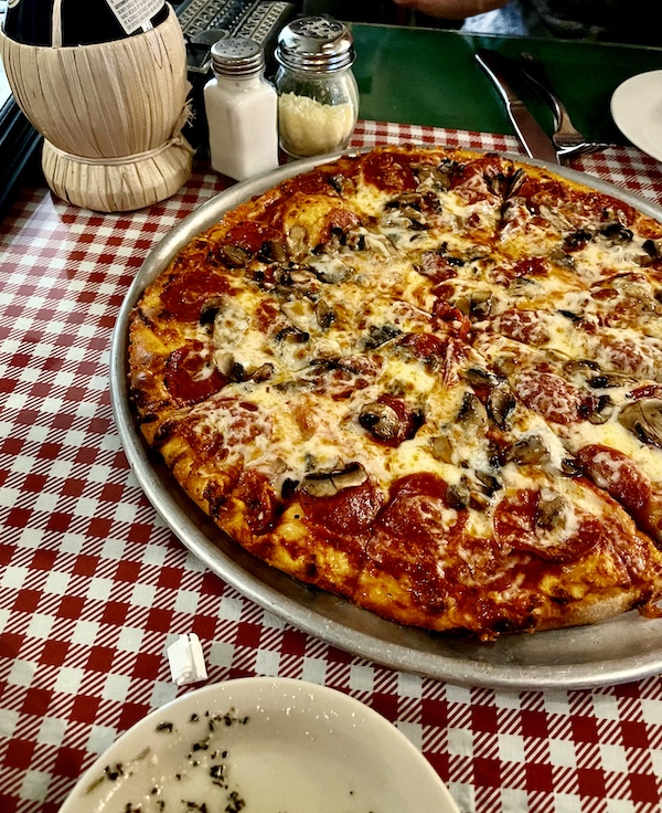 Whole pizza on the table at a restaurant in Hill Country's Wimberley Texas