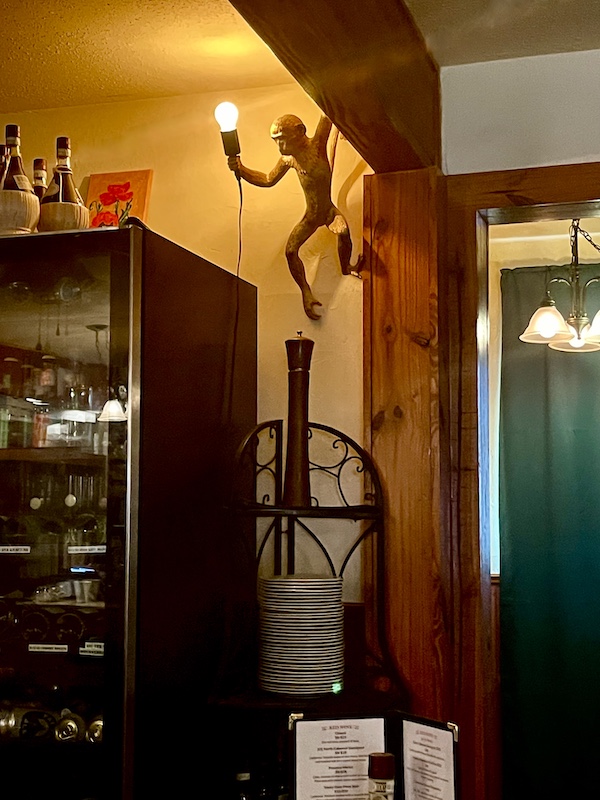 Monkey lamp on the wall inside a restaurant in Hill Country's Wimberley Texas