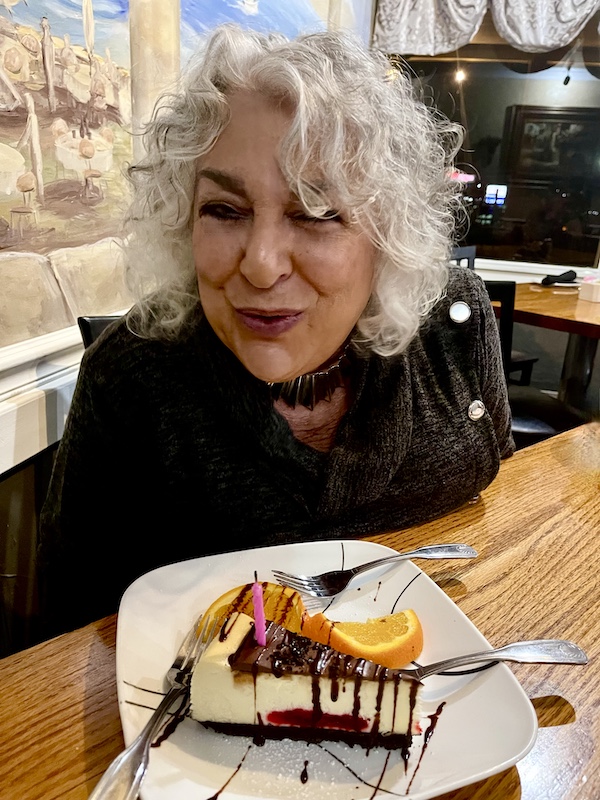 Me blowing out the birthday candle of my cheesecake at Italian Garden Restaurant Canyon Lake TX