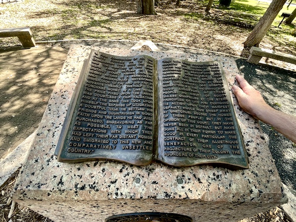 Bronze sculpture of an open book tells a story at Landa Park New Braunfels TX