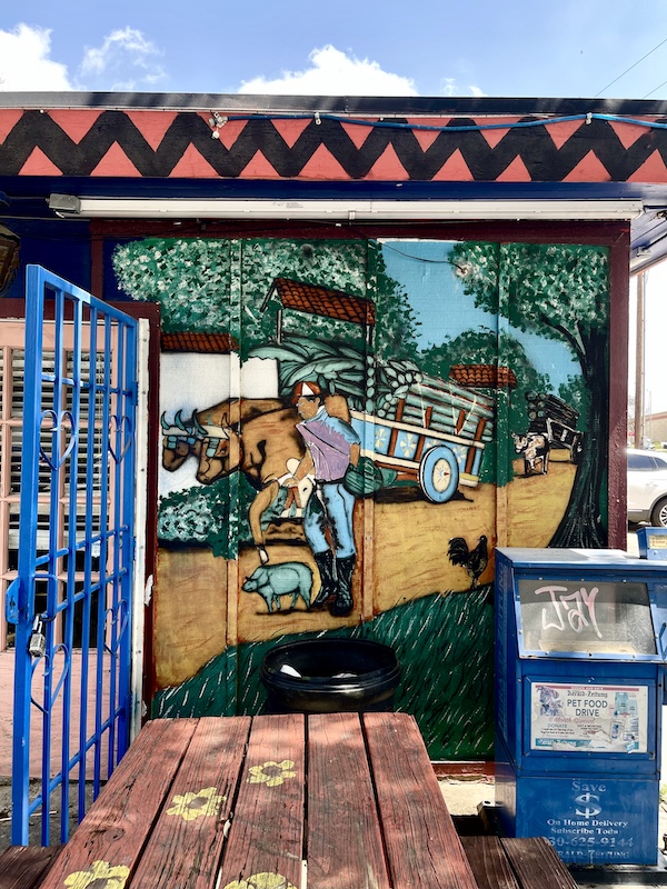 Monterrey Café New Braunfels TX colorful mural of oxen pulling a cart full of produce