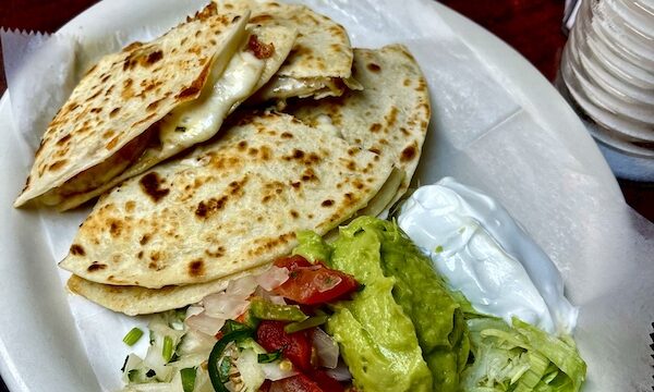 White plate topped with quesadillas and salad at Monterrey Café New Braunfels TX