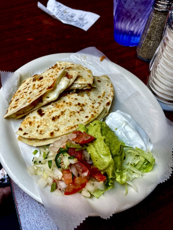 White plate topped with quesadillas and salad at Monterrey Café New Braunfels TX
