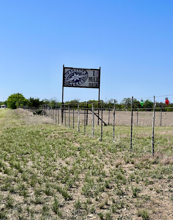 Road sign telling us we passed Luckenbach Texas a mile ago, seen on our way home from our Sunday Funday Fredericksburg Texas