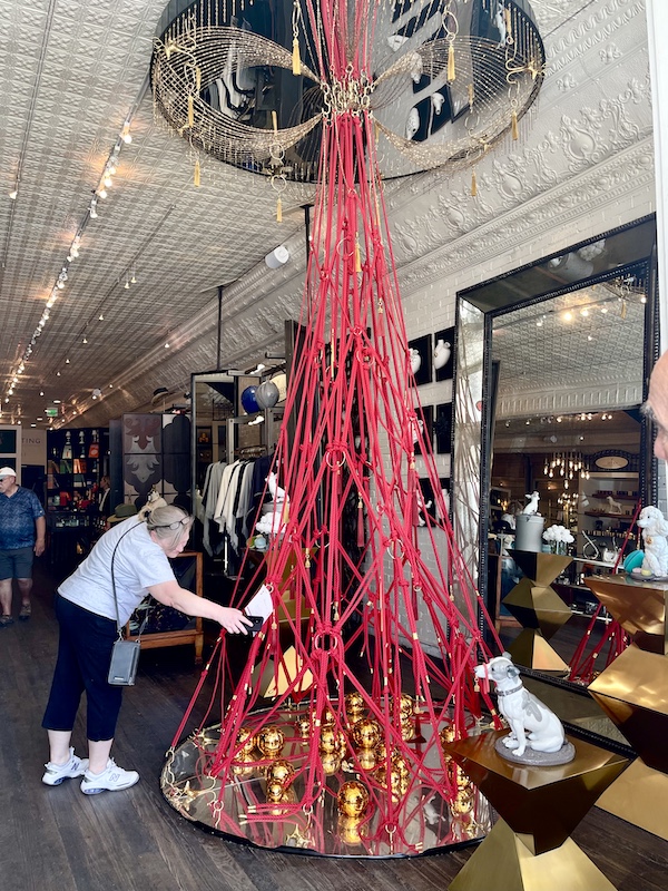 Red rope contemporary Christmas tree in a boutique during our Sunday Funday Fredericksburg Texas