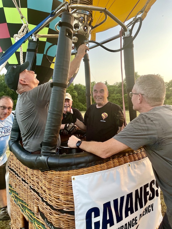 Group of men getting a hot air balloon ready for takeoff at the Hopkins County Dairy Festival 2025