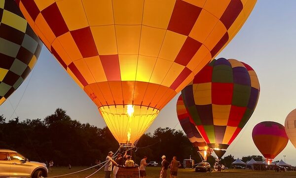 Glowing hot air balloons at the Hopkins County Dairy Festival 2025