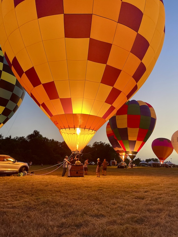 Glowing hot air balloons at the Hopkins County Dairy Festival 2025