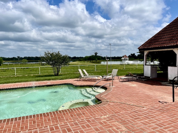 Another view of the pool with lounge chairs and gazebo in Sulphur Springs TX