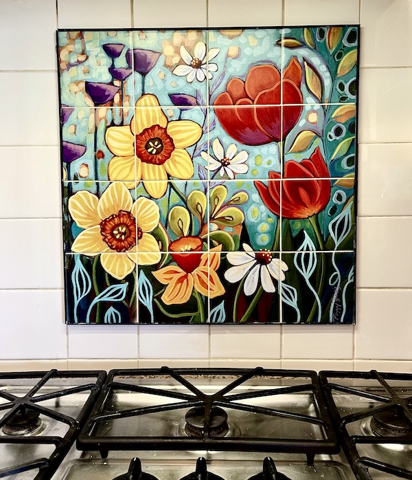 Completed flower mosaic above stove is first part of the Kitchen Transformation in Texas