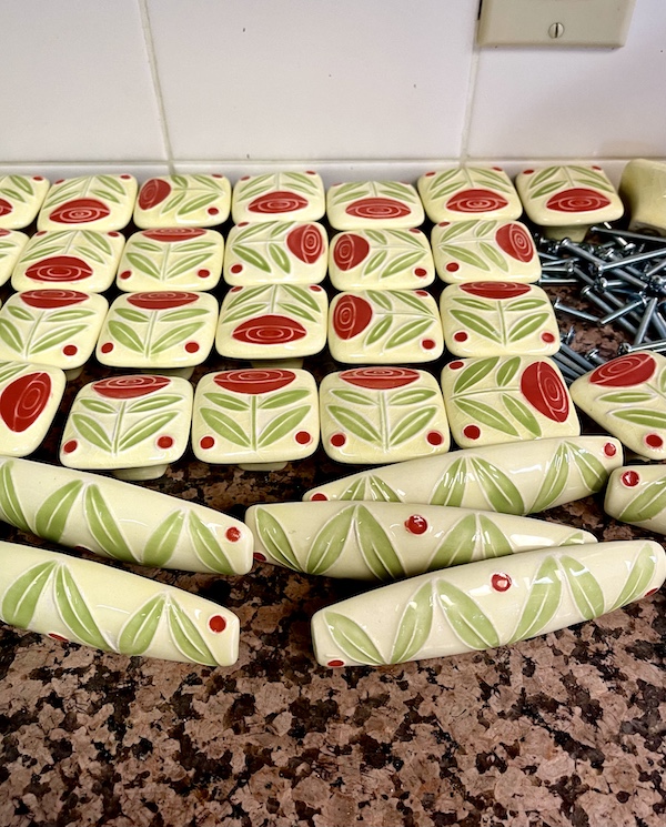 Pale yellow, red and lime green floral ceramic handles on countertop during the Kitchen Transformation in Texas