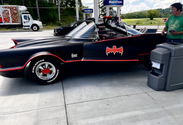 Black car replica of a Batmobile seen at a gas station after our Bonus Visit to NOLA
