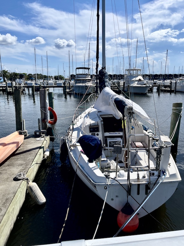 Looking into a white sailboat tied up at the marina visited during our Bonus Visit to NOLA