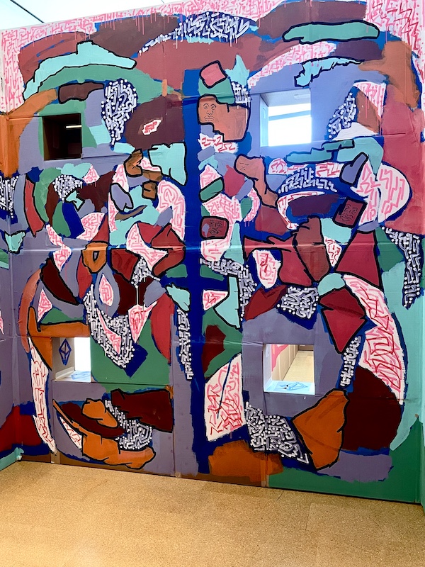 Colorful mural of what looks like a patchwork quilt painted on cardboard at Westmoreland Museum of American Art 2